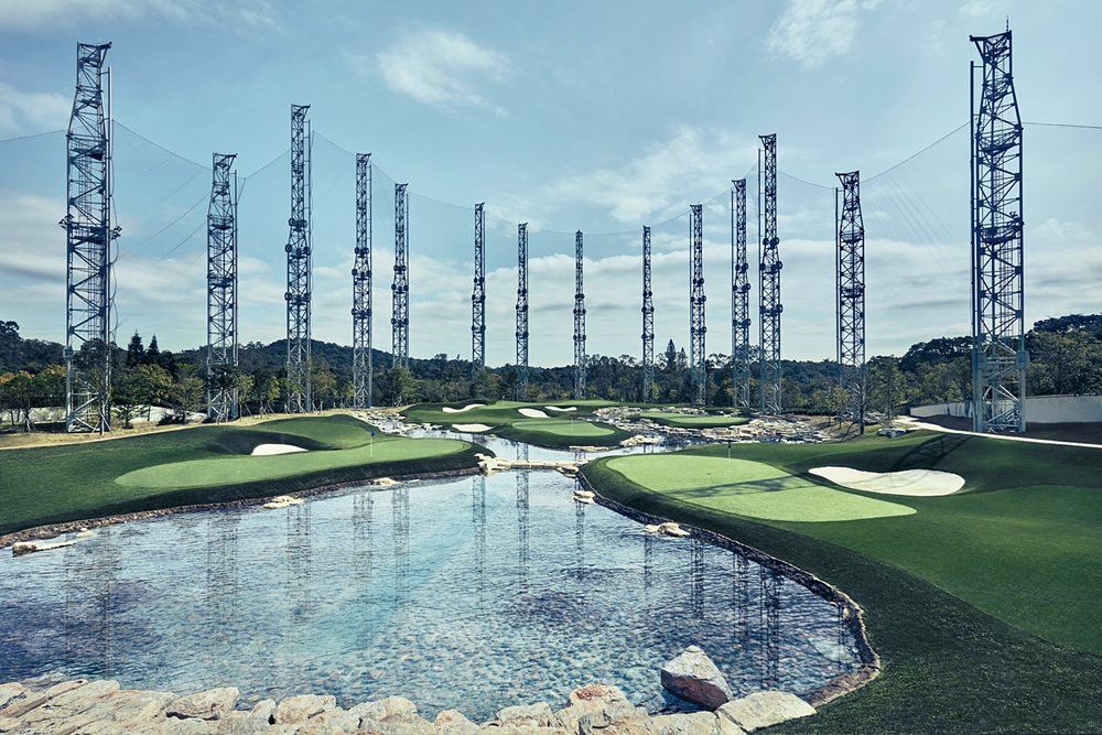 Toronto Synthetic grass golf course with water and tall metal towers