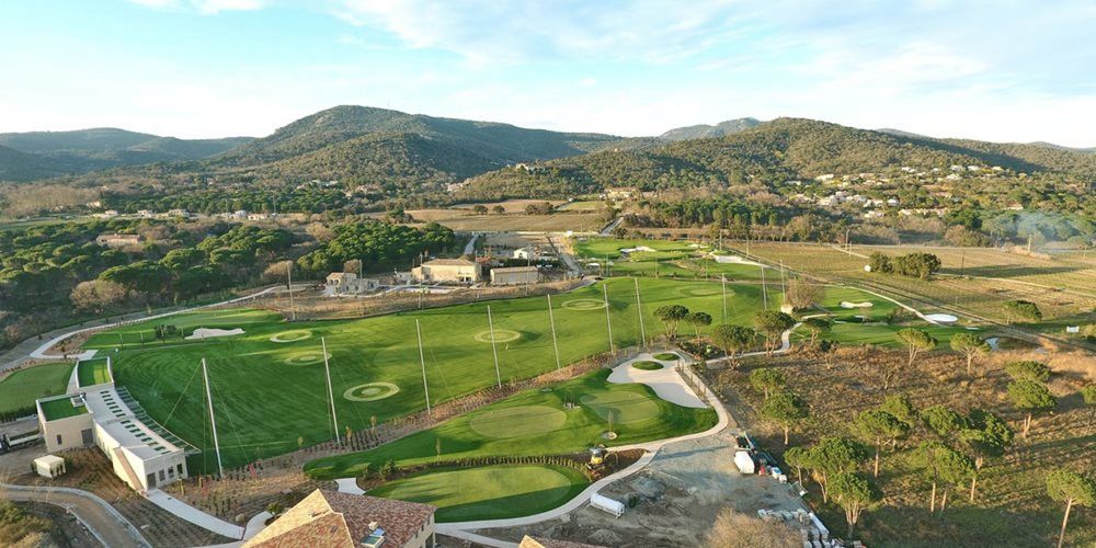 Toronto Aerial view of a synthetic grass golf course surrounded by hills